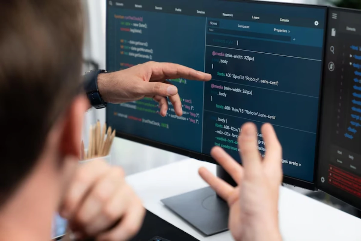 Two men working in AI-software testing