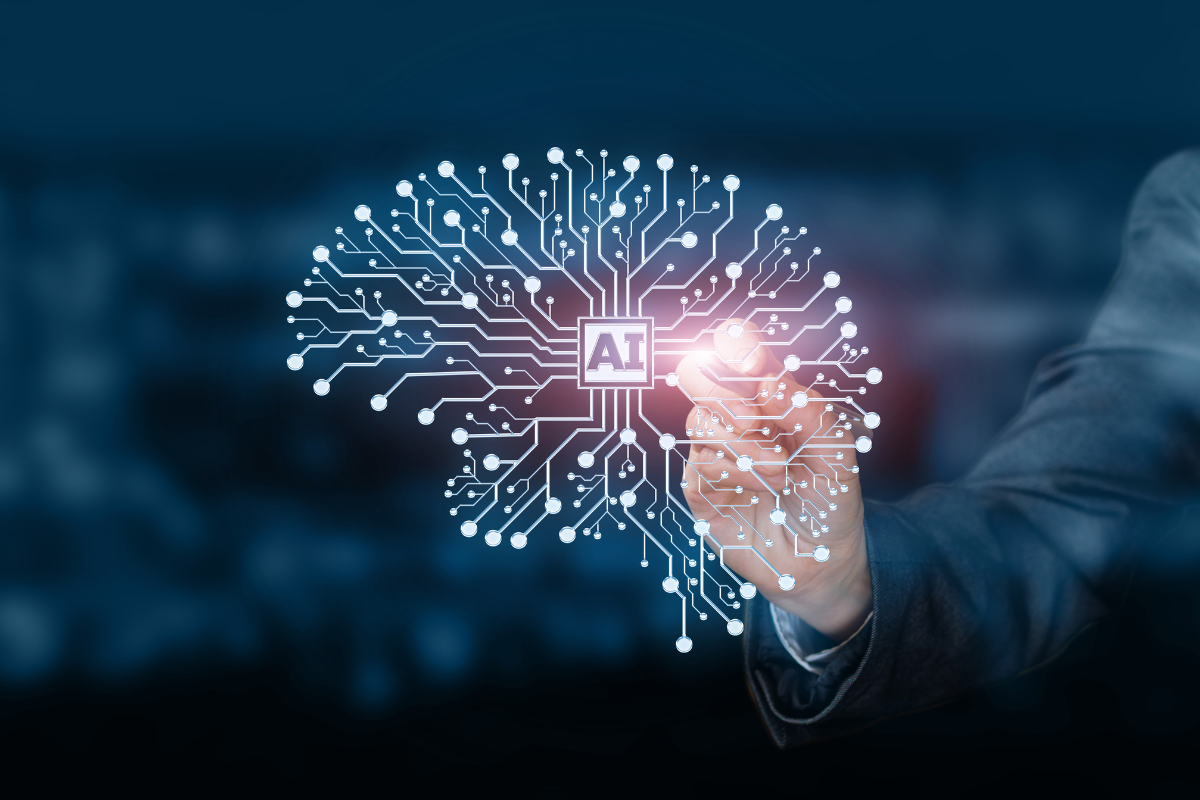 Hands touching a artificial brain to represent artificial intelligence