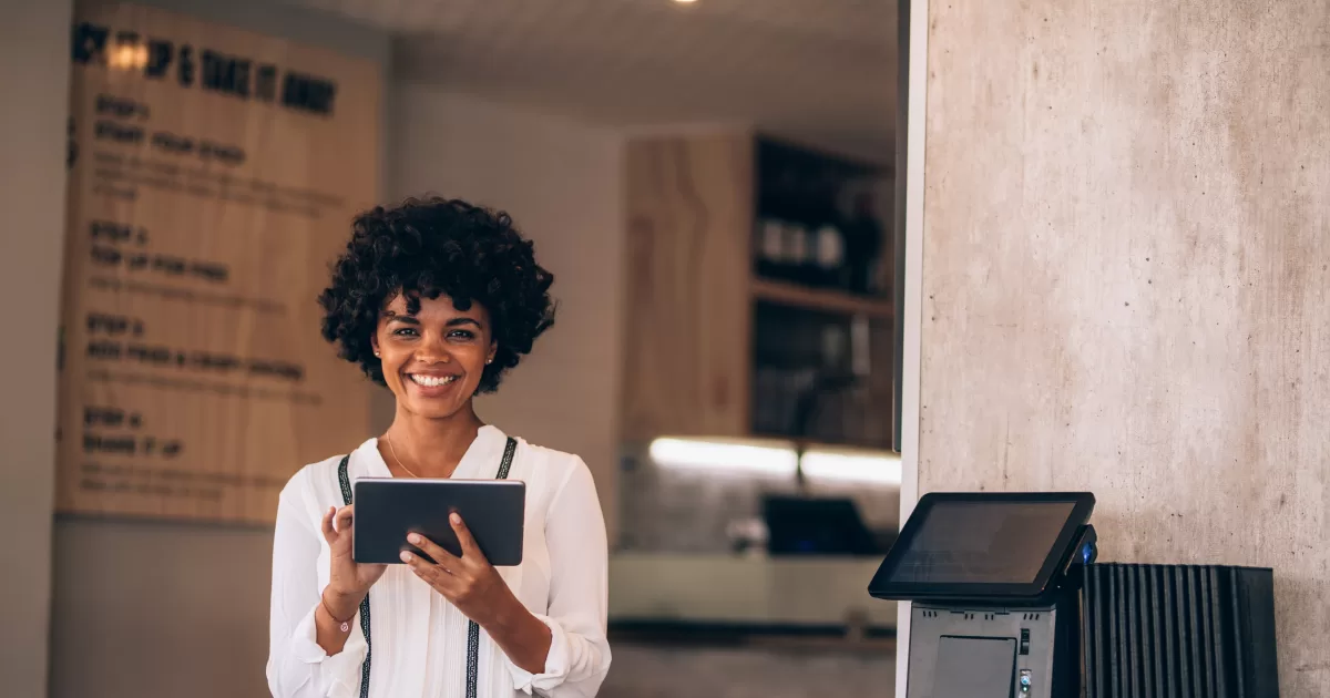 Woman using a tablet at a restaurant