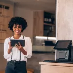 Woman using a tablet at a restaurant