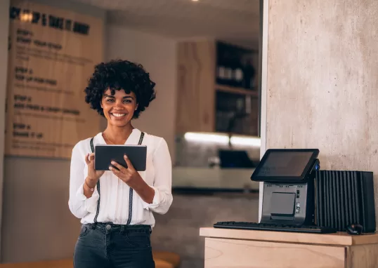Woman using a tablet at a restaurant