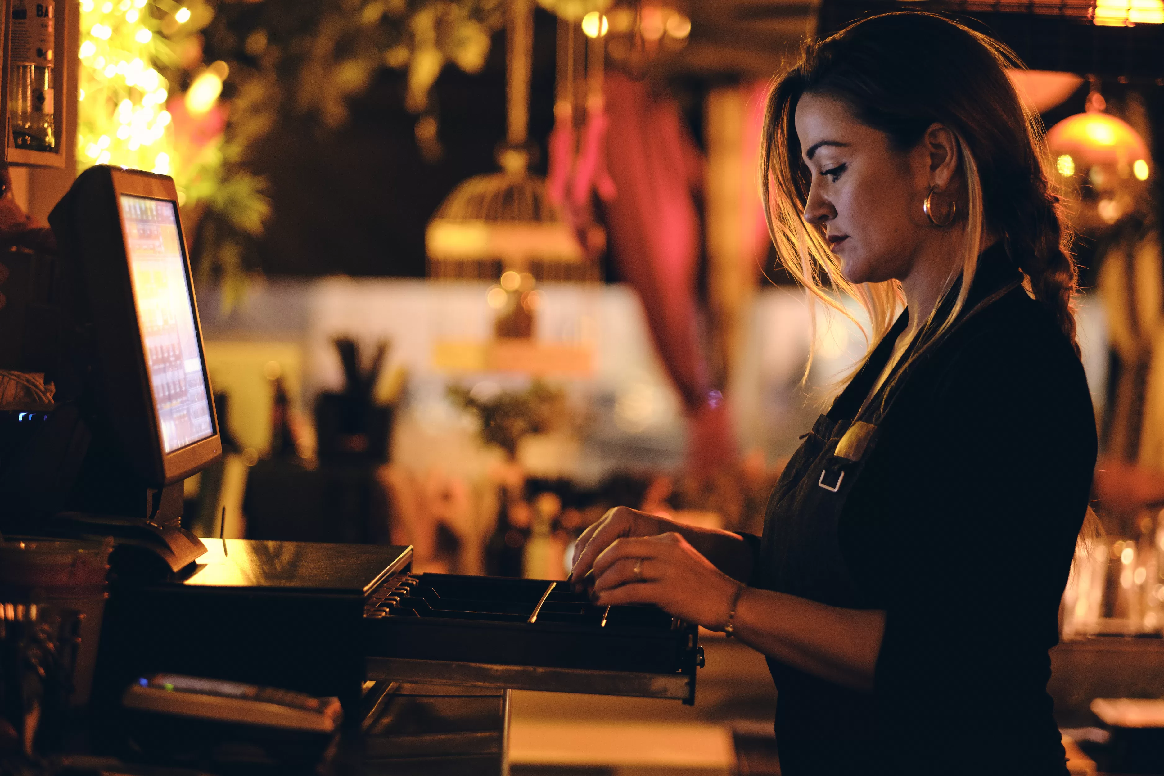 A woman working at a restaurant