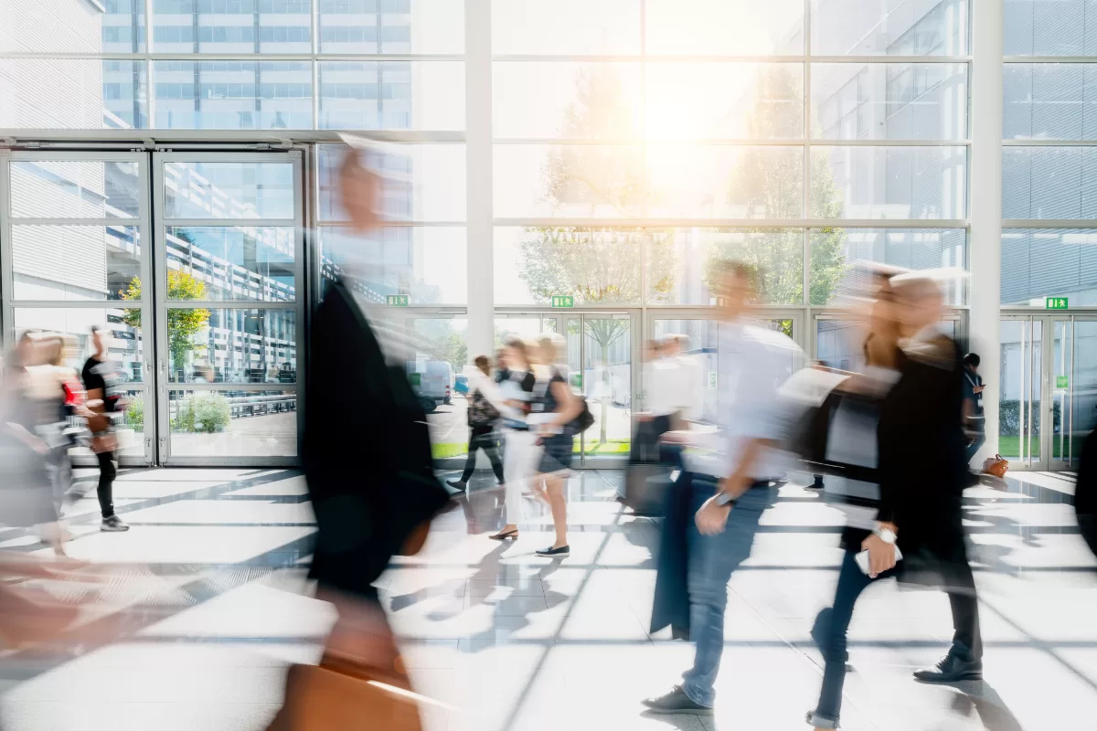 image of blurred people walking in a office