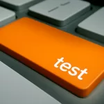 An Orange button with a word "test" written on it, representing shift left testing