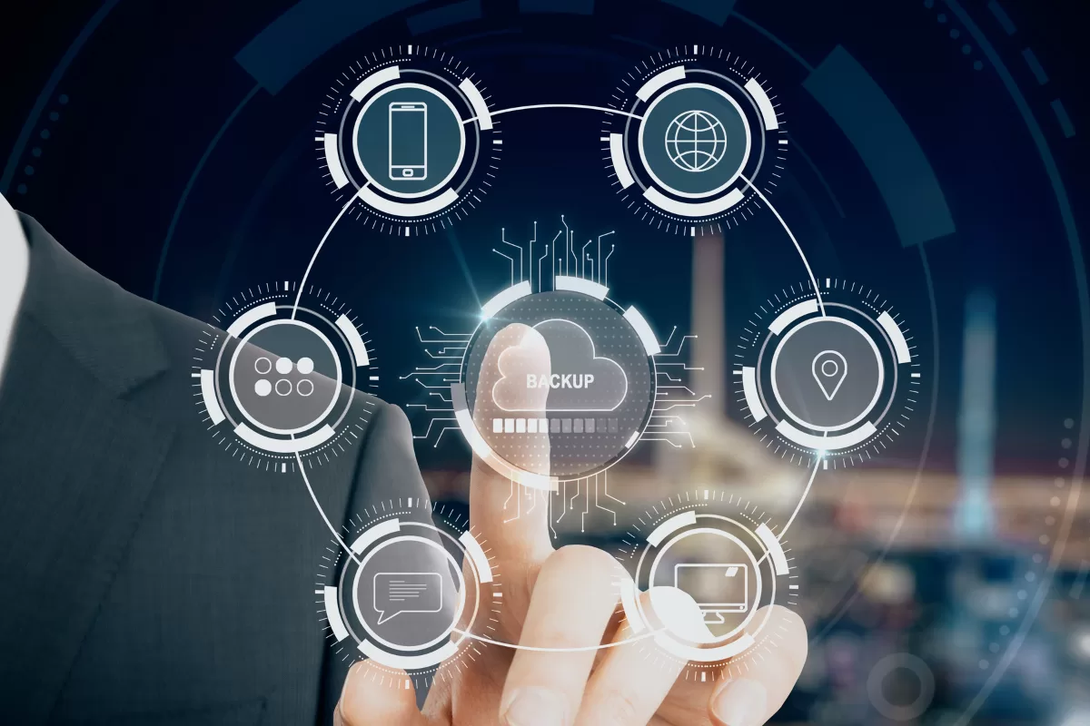Business professional interacting with a virtual interface showing connected cloud backup and system integrations.