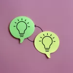 Two green speech bubbles with lightbulb icons connected by arrows, symbolizing idea sharing or knowledge transfer, on a pink background, representing types of software testing