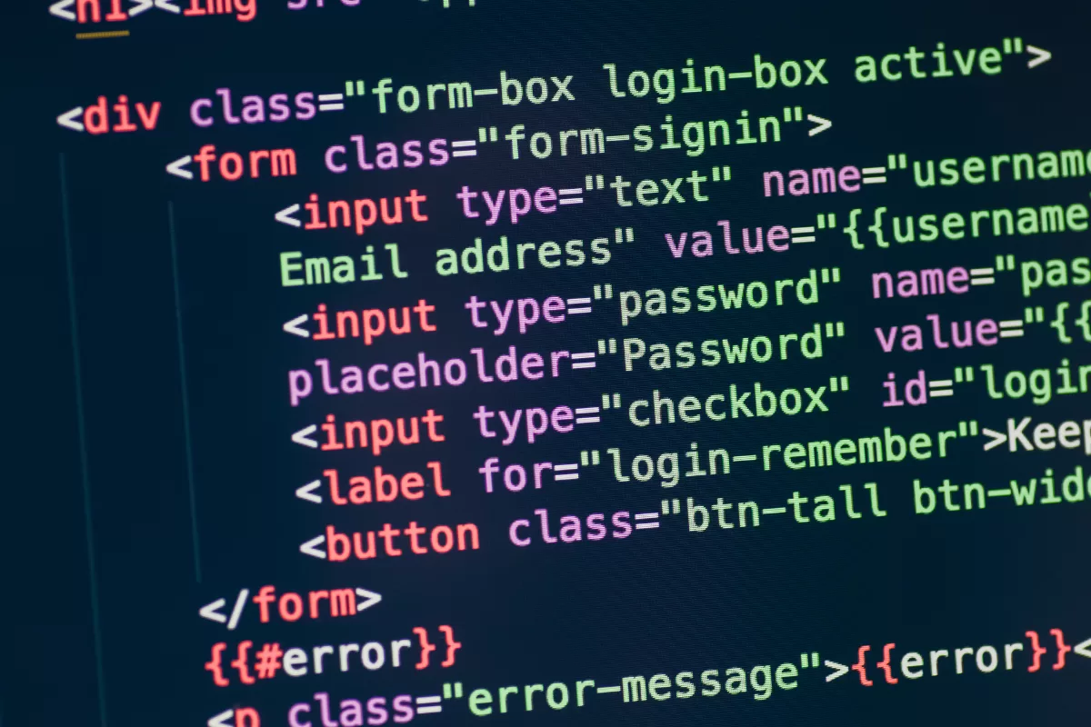 HTML login form code with email and password fields in code editor with colorful syntax highlighting