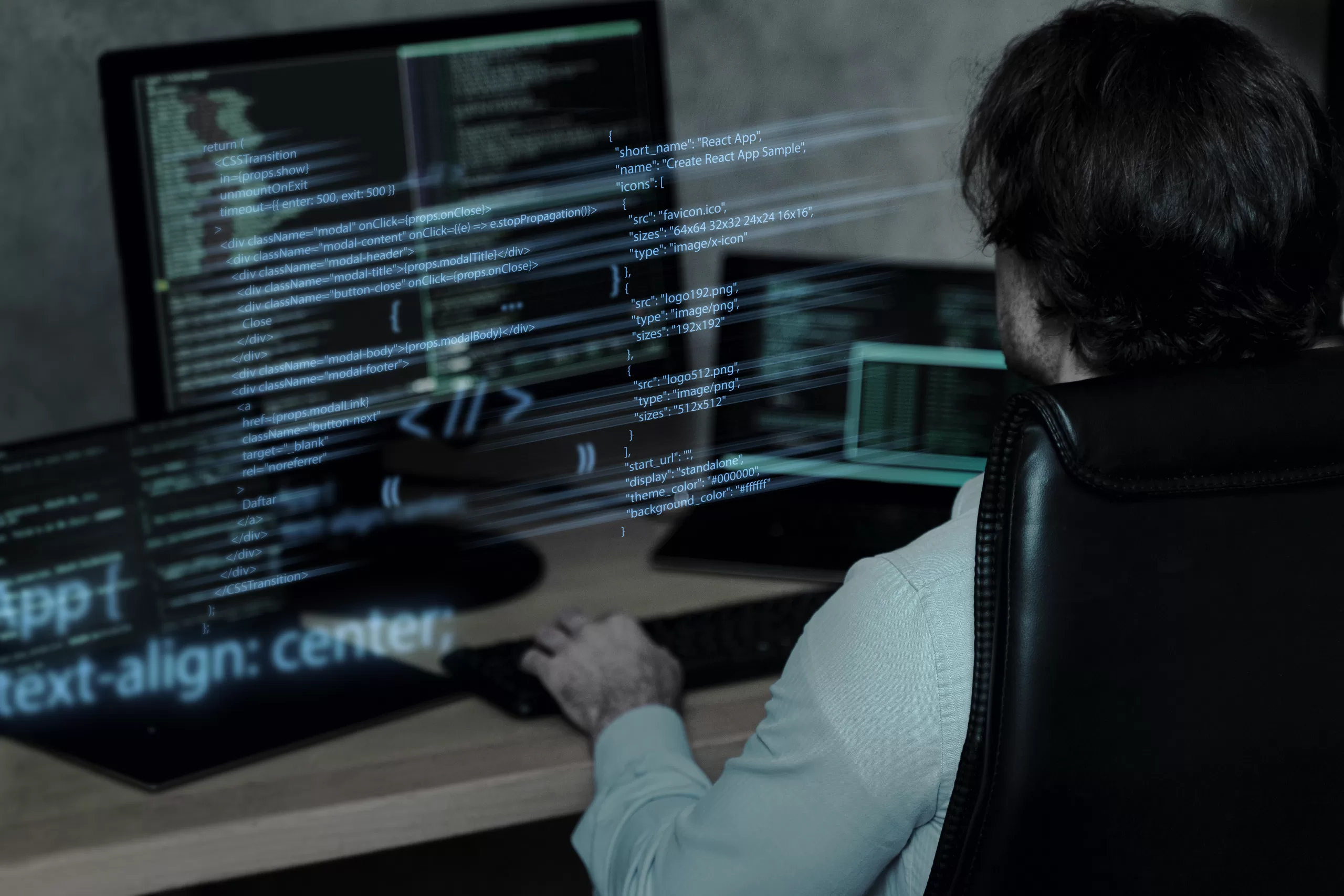 Homem programando em computadores com múltiplas telas mostrando códigos e gráficos digitais.