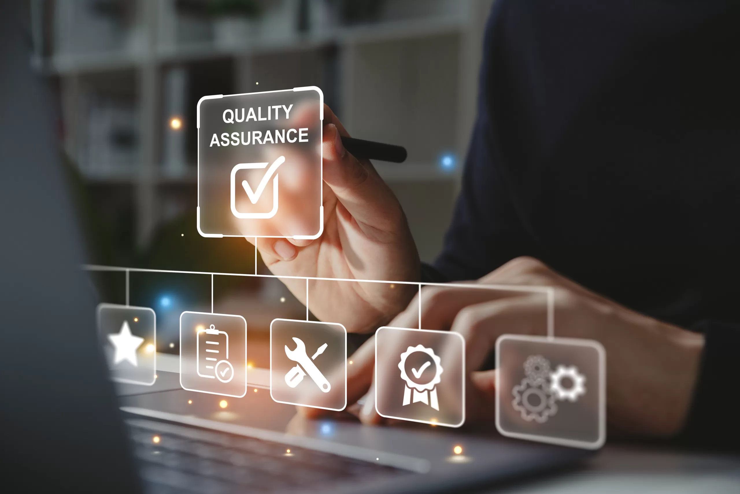 Hand using a stylus to select “Quality Assurance” on a digital interface with checklist and tooling icons.